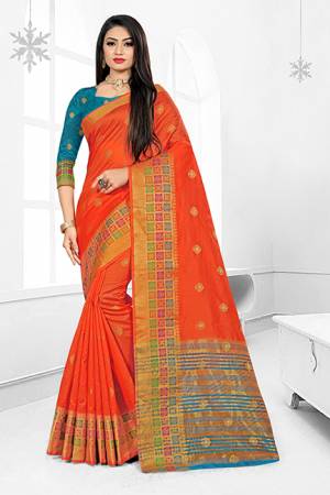 Celebrate This Festive Season With Ease And Comfort Wearing This?Royal Looking Silk Based Saree In Orange Color Paired With Blue Colored Blouse. This Saree Is Cotton Silk Based Paired With Art Silk Fabricated Blouse. Buy Now.