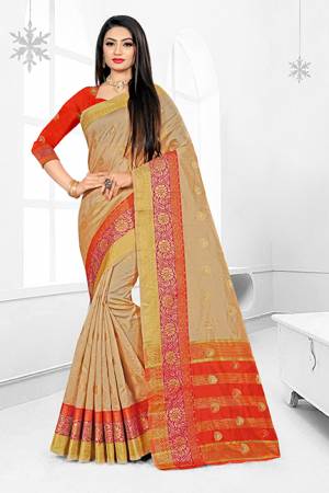 Grab This Very Beautiful Designer Saree With A Royal Silk Touch In Beige Color Paired With Orange Colored Blouse. This Saree Is Fabricated On Cotton Silk Paired With Art Silk Fabricated Blouse. It Has Very Elegant Heavy Weaved Border.