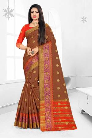 Grab This Very Beautiful Designer Saree With A Royal Silk Touch In Brown Color Paired With Green Colored Blouse. This Saree Is Fabricated On Cotton Silk Paired With Art Silk Fabricated Blouse. It Has Very Elegant Heavy Weaved Border.