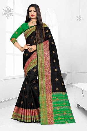 Grab This Very Beautiful Designer Saree With A Royal Silk Touch In Black Color Paired With Green Colored Blouse. This Saree Is Fabricated On Cotton Silk Paired With Art Silk Fabricated Blouse. It Has Very Elegant Heavy Weaved Border.