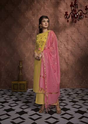 Celebrate This Festive Season With Beauty And Comfort In This Very Pretty Straight Suit In Yellow Color Paired With Contrasting Pink Colored Dupatta. This Designer Readymade Suit Is Silk Based Paired With Banarasi Silk Fabricated Dupatta. 