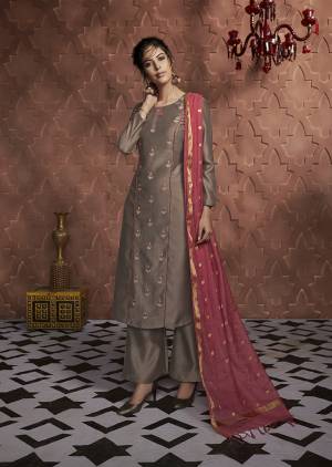 Add This Very Beautiful Suit To Your Wardrobe In Brown Color Paired With Contrasting Crimson Red Colored Dupatta. This Readymade Top And Plazzo Are Fabricated on Soft Silk Paired With Banarasi Silk Fabricated Dupatta. It Is Beautified With Pretty Embroidery Giving It An Enhanced Rich Look. 