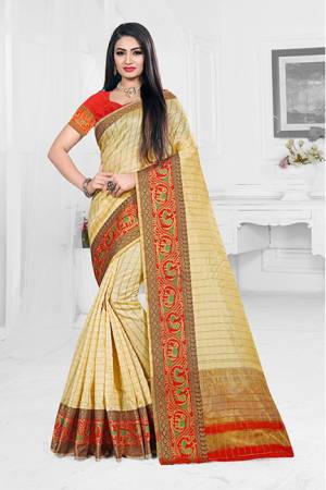 Grab This Very Beautiful Designer Saree With A Royal Silk Touch In Cream Color Paired With Red Colored Blouse. This Saree Is Fabricated On Orgenza Silk Paired With Art Silk Fabricated Blouse. It Has Very Elegant Heavy Weaved Border.