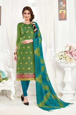 Add This Pretty Dress Material For Your Casual Or Semi-Casual Wear In Green And Blue Color. Its Top And Dupatta Are Fabricated On Banarasi Art Silk Paired With Cotton Bottom. Buy This Dress Material Now.