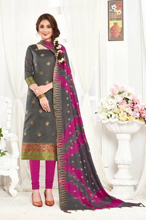 If Those Readymade Suit Does Not Lend You The Desired Comfort Than Grab This Dress Material In Grey  Colored Top Paired With Magenta Colored Bottom And Grey And Magenta Pink Dupatta And Get This Stitched As Per Your Desired Fit And Comfort. Its Top And Dupatta Are Fabricated On Banarasi Art Silk Paired With Cotton Fabricated Bottom. 