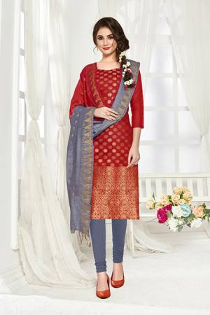 Add This Pretty Dress Material For Your Casual Or Semi-Casual Wear In Red And Grey Color. Its Top And Dupatta Are Fabricated On Banarasi Art Silk Paired With Cotton Bottom. Buy This Dress Material Now.