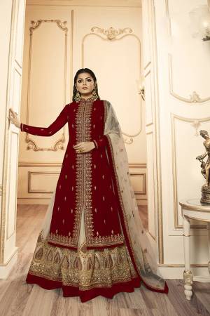 Grab This Beautiful And Heavy Designer Suit With Two Bottoms In Maroon And Cream Color. Its Embroidered Top Is Fabricated Georgette Satin Paired With One Santoon Plain Bottom And Another Embroidered Lehenga Is Fabricated On Net Paired With Net Fabricated Dupatta. Its Rich Color Pallete And Detailed Embroidery Will Eanr You Lots Of Compliments From Onlookers. 