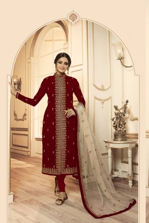 Grab This Beautiful And Heavy Designer Suit With Two Bottoms In Maroon And Cream Color. Its Embroidered Top Is Fabricated Georgette Satin Paired With One Santoon Plain Bottom And Another Embroidered Lehenga Is Fabricated On Net Paired With Net Fabricated Dupatta. Its Rich Color Pallete And Detailed Embroidery Will Eanr You Lots Of Compliments From Onlookers. 