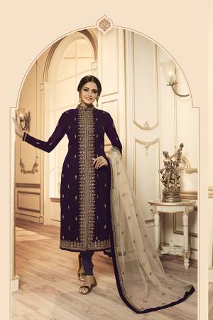 Grab This Beautiful And Heavy Designer Suit With Two Bottoms In Dark Purple And Cream Color. Its Embroidered Top Is Fabricated Georgette Satin Paired With One Santoon Plain Bottom And Another Embroidered Lehenga Is Fabricated On Georgette Paired With Georgette Fabricated Dupatta. Its Rich Color Pallete And Detailed Embroidery Will Eanr You Lots Of Compliments From Onlookers. 