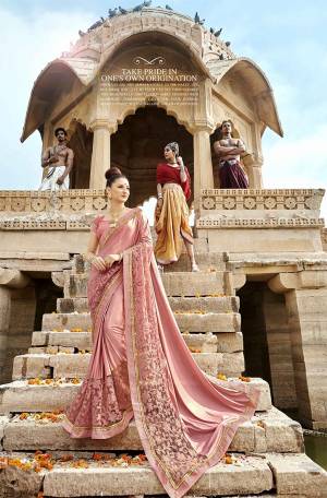 Look Pretty In This Very Beautiful And Subtle Saree In Baby Pink Color. This Pretty Saree Is Lycra And Net Based Paired With Art Silk Fabricated Blouse. Its Pretty Color And Rich Fabric Will Earn you Lots Of Compliments From Onlookers.
