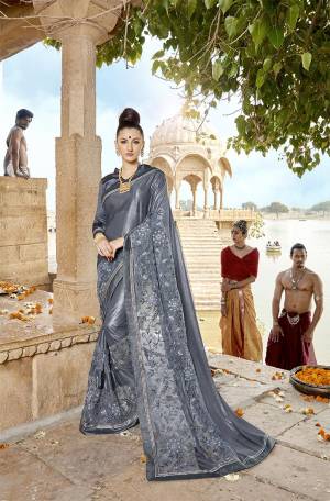 Flaunt Your Rich And Elegant Taste Wearing This Designer Saree In Elegant Grey Color .This Saree Is Fabricated on Lycra And Net Paired With Art Silk Fabricated Blouse. Buy This Saree Now.