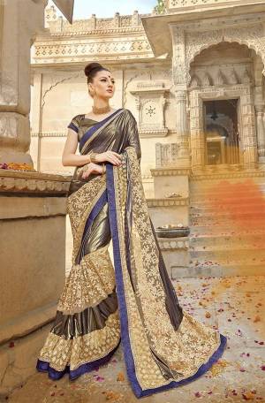 For A Bold And Beautiful Look, Grab This Fancy Designer Saree In Copper And Cream Color Paired With Copper Colored Blouse, This Saree Is Fabricated On Lycra And Net Paired With Art Silk Fabricated Blouse. This Saree IS Light Weight And Easy To Drape. Buy Now.
