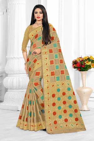 Go With The Pretty Subtle Shades With This Designer Checks Patterned Saree In Beige Color. This Saree Is Cotton Silk Based Paired With Art Silk Fabricated Blouse. Buy Now.