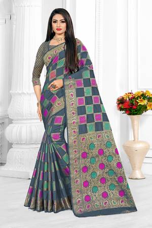 Here Is A Beautiful Designer Silk Based Saree In Dark Grey Color. This Pretty Checks Patterned Saree Is Fabricated On Cotton Silk Paired With Art Silk Fabricated Blouse. Buy This Saree Now.