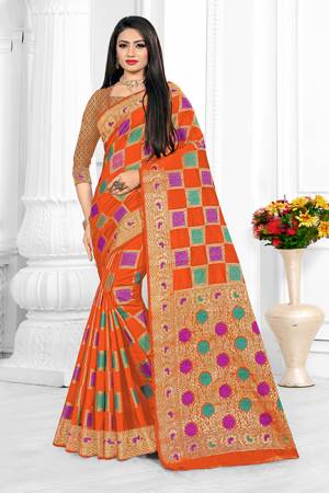 For A Proper Traditional Look With Traditional Color Pallete, Grab This Designer Saree In Orange Color. This Saree Is Fabricated On Cotton Silk Beautified With Checks Pattern Paired With art Silk Fabricated Blouse.