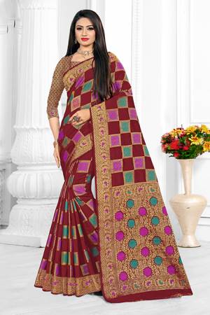 Go With The Elegant Rpyal Shades With This Designer Checks Patterned Saree In Maroon Color. This Saree Is Cotton Silk Based Paired With Art Silk Fabricated Blouse. Buy Now.