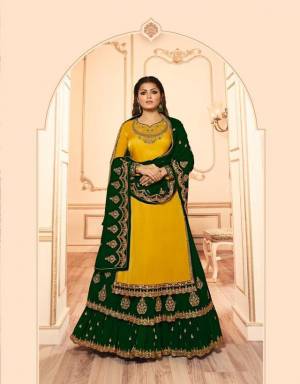 Get Ready For The Upcoming Festive And Wedding Season With This Designer Two In One Indo Western Suit In Yellow And Dark Green. This Its Embroidered Top Is Georgette Satin Based Paired With Santoon Bottom And Georgette Fabricated Lehenga And Dupatta. 