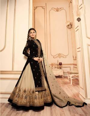 Very Beautiful Shaded Indo-Western Suit Is Here In Black And Cream color. Its Beautiful Top IS Fabricated On Georgette Satin Paired With santoon Bottom, Net Fabricated Lehenga And Dupatta.Buy This Designer Two In One Suit Now.