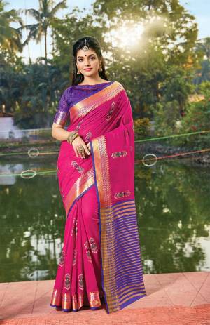 Grab This Very Beautiful Pretty Elegant Saree In Dark Pink Color Paired With Contrasting Purple Colored Blouse. This Saree Ans Blouse Are Fabricated On Handloom Cotton Beautified With Pretty Embroidered Buttis. 