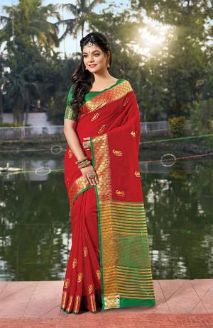Grab This Very Beautiful Pretty Elegant Saree In Red Color Paired With Contrasting Green Colored Blouse. This Saree Ans Blouse Are Fabricated On Handloom Cotton Beautified With Pretty Embroidered Buttis. 