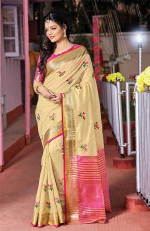 Grab This Very Beautiful Pretty Elegant Saree In Cream Color Paired With Contrasting Pink Colored Blouse. This Saree Ans Blouse Are Fabricated On Handloom Cotton Beautified With Pretty Embroidered Buttis. 