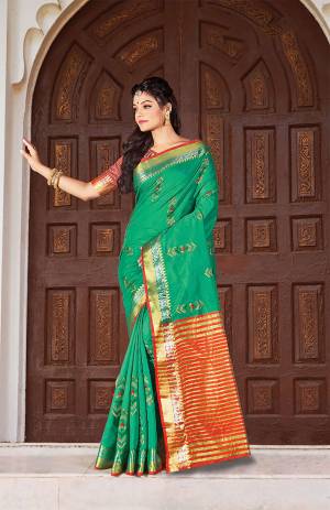 Grab This Very Beautiful Pretty Elegant Saree In Green Color Paired With Contrasting Red Colored Blouse. This Saree Ans Blouse Are Fabricated On Handloom Cotton Beautified With Pretty Embroidered Buttis. 