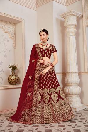 Get Ready For Your D-Day With This Heavy Designer Lehenga Choli In?All Over Maroon Color. This Heavy Embroidered Lehenga Choli Is Fabricated On Velvet Paired With Net Fabricated Dupatta. It Is Beautified With Heavy Coding Jari Embroidery. Buy This Bridal Lehenga Now.