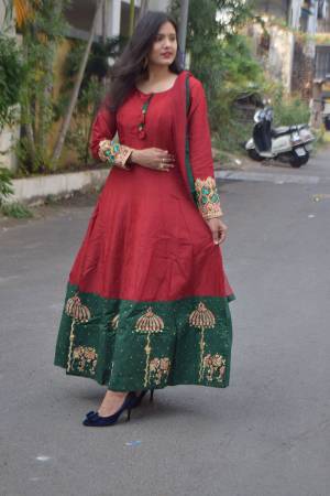 Enhance Your Personality Wearing This Readymade Floor Length Suit In Maroon And Green Color Paired With Maroon Colored Bottom And  Dupatta. This Suit Is Fabricated on Art Silk Paired With Santoon Bottom And Net Fabricated Dupatta. It IS Beautified With Contrasting Thread Work. 