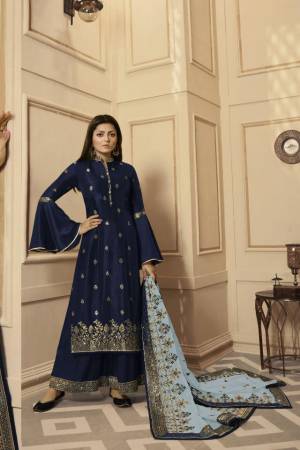 Get Ready For The Upcoming Festive And Wedding Season With This Very Beautiful Designer Straight Suit In Navy Blue Color Paired With Grey Colored Dupatta. Its Embroidered Top Is Satin Georgette Based Paired With Santoon Bottom And Net Fabricated Heavy Embroidered Dupatta. Buy This Lovely Suit Now.