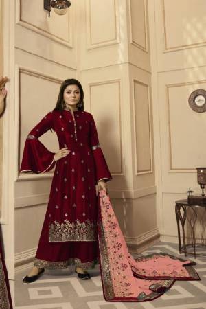 Get Ready For The Upcoming Festive And Wedding Season With This Very Beautiful Designer Straight Suit In Maroon Color Paired With Peach Colored Dupatta. Its Embroidered Top Is Satin Georgette Based Paired With Santoon Bottom And Net Fabricated Heavy Embroidered Dupatta. Buy This Lovely Suit Now.