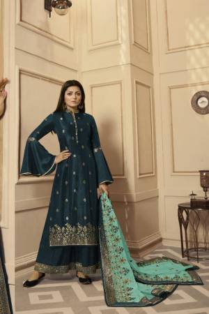 Get Ready For The Upcoming Festive And Wedding Season With This Very Beautiful Designer Straight Suit In Teal Blue Color Paired With Sea Green Colored Dupatta. Its Embroidered Top Is Satin Georgette Based Paired With Santoon Bottom And Net Fabricated Heavy Embroidered Dupatta. Buy This Lovely Suit Now.