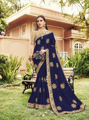 Celebrate This Festive Season With Beauty And Comfort Wearing This Heavy Designer Saree In Royal Blue Color Paired With Cream Colored Blouse. This Saree Is Georgette Based Paired With art Silk Fabricated Blouse. It Is Light In Weight And Easy To Carry All Day Long. 