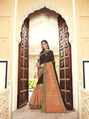Here Is A Very Beautiful Heavy Designer Saree In Brown And Orange Color Paired With Brown Colored Blouse. This Saree And Blouse are Silk Based Beautified With Heavy Embroidery Which also Gives A Rich Look To Your Personality.