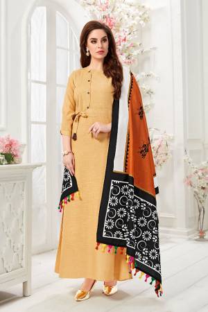 Here Is A Pretty Readymade Gown In Beige Color Paired With Rust Orange And Black Colored Dupatta. This Pretty Gown Is Fabricated On Cotton Slub Paired With Chanderi Cotton Fabricated Dupatta Beautified With Digital Prints. 
