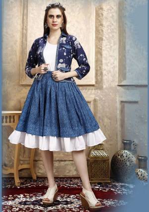 Here Is A Pretty Three Piece Western Set In White Colored Top Paired With Blue Colored Skirt And Navy Blue Colored Printed Jacket. Its Top Is Fabricated on Cotton Lycra Paired With Rayon Fabricated Skirt and Jacket. 
