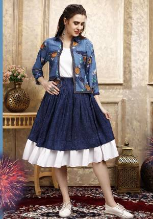 Here Is A Pretty Three Piece Western Set In White Colored Top Paired With Blue Colored Skirt And Blue Colored Printed Jacket. Its Top Is Fabricated on Cotton Lycra Paired With Rayon Fabricated Skirt and Jacket. 