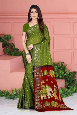 Celebrate This Festive Season Wearing This Pretty Saree In Olive Green Color. This Saree And Blouse Are Silk Based Beautified With Prints. Also It Is Light In Weight Which Is Perfect For Festive Wear. Buy Now.