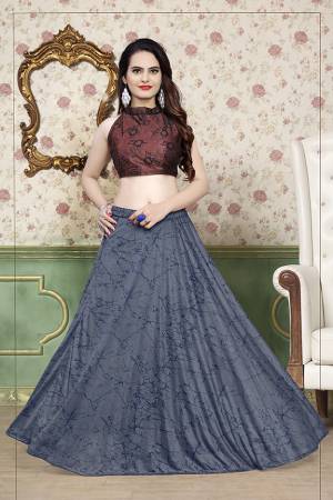 Grab This Beautiful Pair Of Lehenga Choli In Brown And Grey Color Fabricated On Lycra. It Has Fully Stitched Lehenga And Unstitched Blouse. Also It Is Beautified With Foil Print Giving It An Attractive Look. Buy Now.