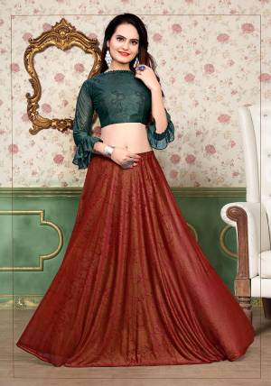 Grab This Beautiful Pair Of Lehenga Choli In Teal Green And Red Color Fabricated On Lycra. It Has Fully Stitched Lehenga And Unstitched Blouse. Also It Is Beautified With Foil Print Giving It An Attractive Look. Buy Now.