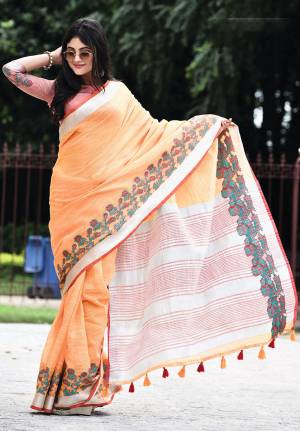 Flaunt Your Rich And Elegant Taste Wearing This Pretty Saree In Orange Color Paired With Red Colored Blouse. This Saree And Blouse Are Fabricated On Linen Beautified With Floral Weave. It Is Light In Weight And Gives A Rich Look To Your Personality. 