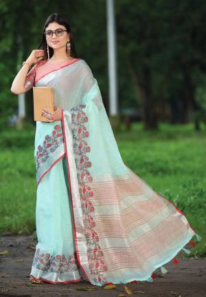 Celebrate This Festive Season with beauty and Comfort In This Lovely Aqua Blue Colored saree Paired With Peach Colored Blouse. This Saree And Blouse Are Fabricated On Linen Which Gives A Rich And Elegant Look. Buy This Pretty Saree Now.