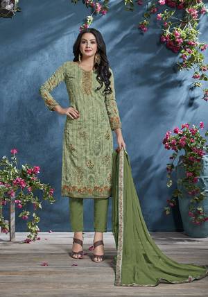 Add This Pretty Designer Straight Suit To Your Wardrobe In Green Color. This Petty Semi-Stitched Suit Is Cotton Based Paired With Santoon Bottom And Chiffon Dupatta. Its Top Is Beautified With Prints And Tone To Tone Resham Embroidery. Buy Now.
