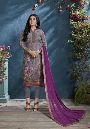 Here Is A Beautiful Shade To Add Into Your Wardrobe With This Designer Straight Suit In Mauve Color Paired With Purple Colored Dupatta. Its Tone To Tone Embroidered Top Is Cotton Based Paired With Santoon Bottom and Chiffon Fabricated Dupatta. 