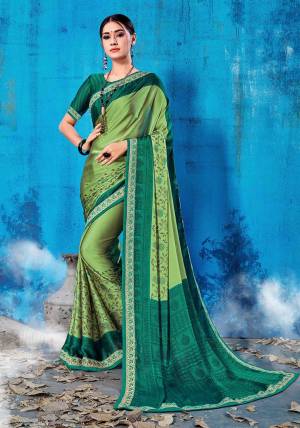 Add This Lovely Printed Saree To Your Wardrobe In Green Color Paired With Pine Green Colored Blouse. This Saree And Blouse Are Soft Silk Based Which Is Durable And Gives A Rich Look To Your Personality. Buy Now.