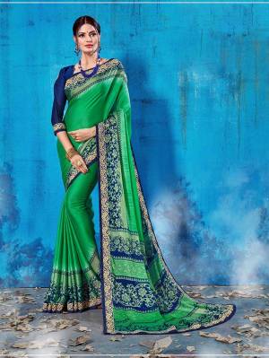 Add This Lovely Printed Saree To Your Wardrobe In Green Color Paired With Navy Blue Colored Blouse. This Saree And Blouse Are Soft Silk Based Which Is Durable And Gives A Rich Look To Your Personality. Buy Now.