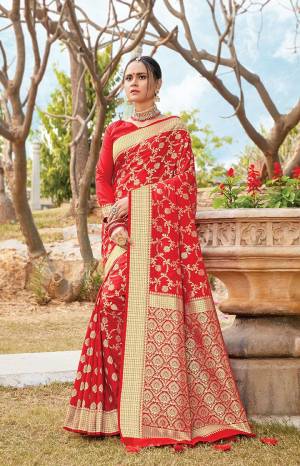 Get Ready For The Upcoming Wedding & Festive Season With This Pretty Saree In Red Color Paired With Red Colored Blouse. This Saree And Blouse Are Fabricated On Art Silk Beautified With Weave All Over. Its Lovely Color and Weave Will Give An Attractive Look To Your Personality. 