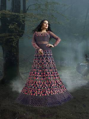 Grab This Heavy Designer Floor Length Suit In Violet Color For The Upcoming Wedding Season. This Very Beautiful And Heavy Embroidered Floor Length Top Is Fabricated On Net Paired With Silk based Bottom And Net Fabricated Dupatta. Its Detailed Embroidery With Perfect Color Combination Will Earn You Lots Of Compliments From Onlookers.