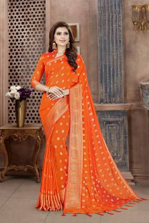 Celebrate This Festive Season In This Attractive Bright Orange Colored Saree. This Saree And Blouse Are Fabricated On Art Silk Beautified With Weaving And Stone Work. This Silk Based Saree Gives A Rich Look To Your Personality. 