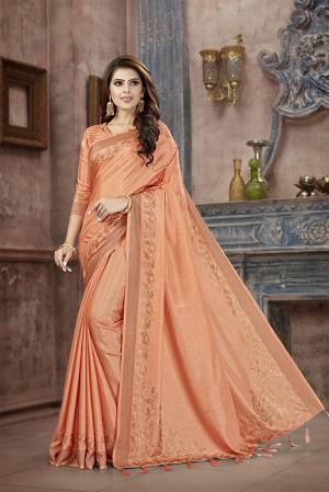 You Will Definitely Earn Lots Of Compliments Wearing This Designer Saree In Light Orange Color. This Pretty Saree And Blouse Are Silk Fabricated on Manipuri Art Silk Beautified With Attractive Stone Work Giving It A Rich And Subtle Look. Buy Now.