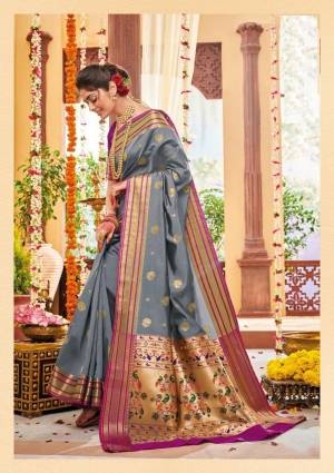 Flaunt Your Rich And Elegant Taste Wearing This Lovely Silk Based Saree In Grey Color Paired With Contrasting Purple Colored Blouse. This Saree And Blouse Are Fabricated On Banarasi Art Silk Beautified With Weave. Buy Now.